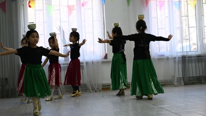 Dancers perform a Uyghur dance at the Sunshine dance studio