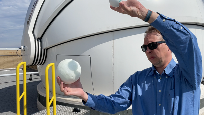 Astronomer Jason Wright mimics the solar eclipse with styrofoam balls