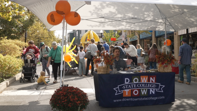 The information table at the top of South Allen Street, where the festival started.