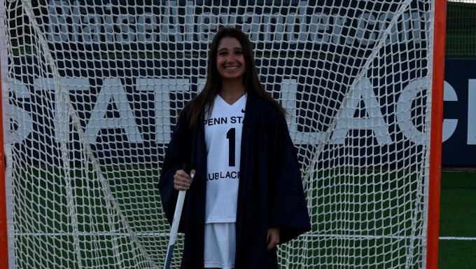 Raquel Baskin poses for a graduation photo in her club lacrosse uniform.