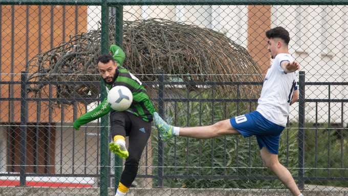 Two Syrian refugee soccer players on the field in Turkey