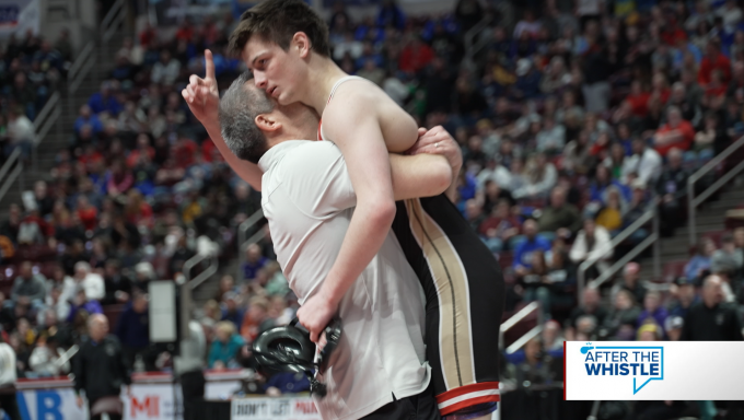 Wrestler celebrating with coach after win