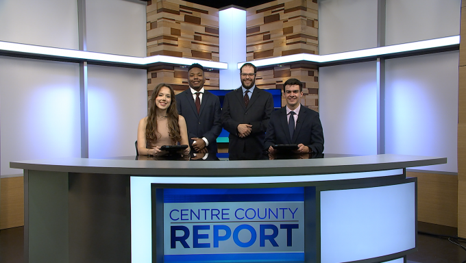 Four anchors sitting behind Centre County Report newsdesk.