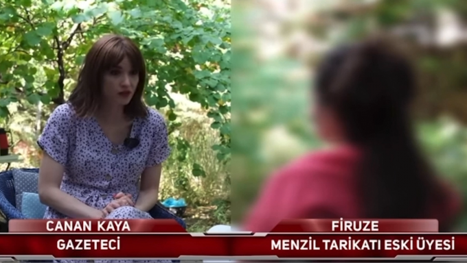 Turkish journalist interviewing a blurred individual in an archival photo