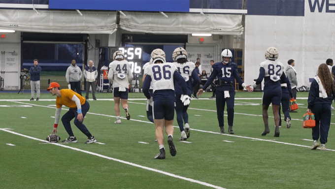 Drew Allar high fives Khalil Dinkins and the other tight ends