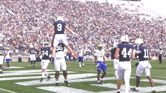 Beau Pribula gets lifted up after scoring rushing touchdown