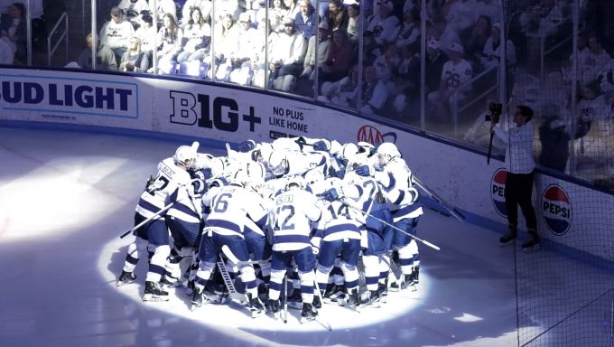Penn State Men's Hockey huddles around the net before a February 28 game against Minnesota