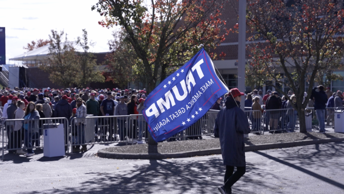 Trump supporter holding flag