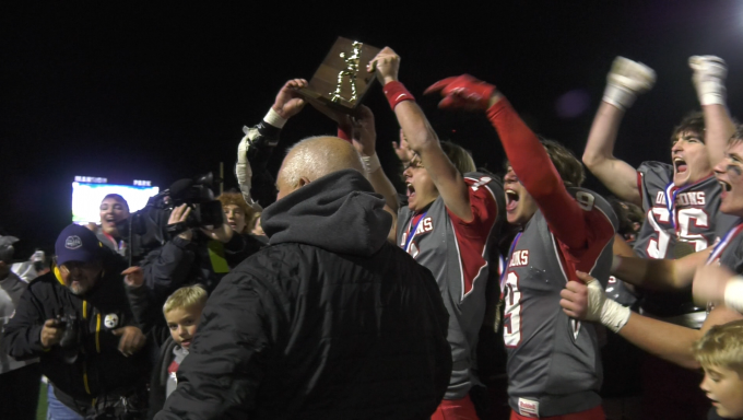 Central Dragons raise the District 6 3A championship trophy after their 35-28 victory over Penn Cambria