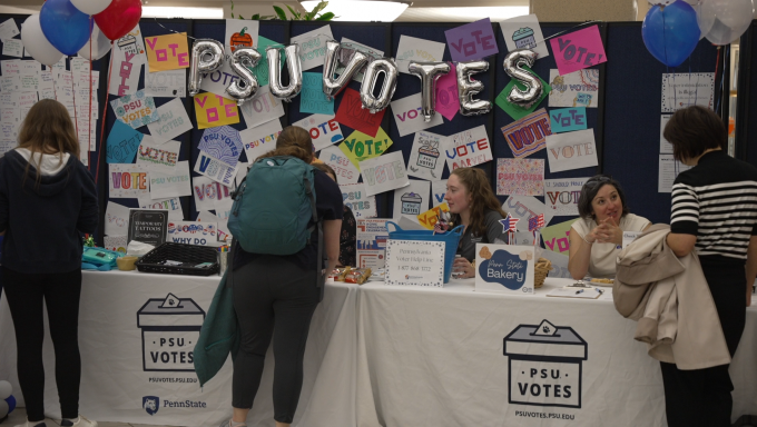 PSU Votes booth with students and faculty inside of the HUB