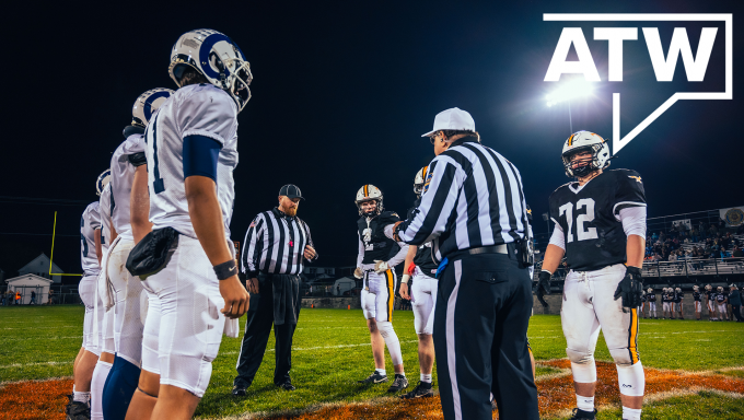 Football players from Tyrone and Penns Valley gather for a coin toss