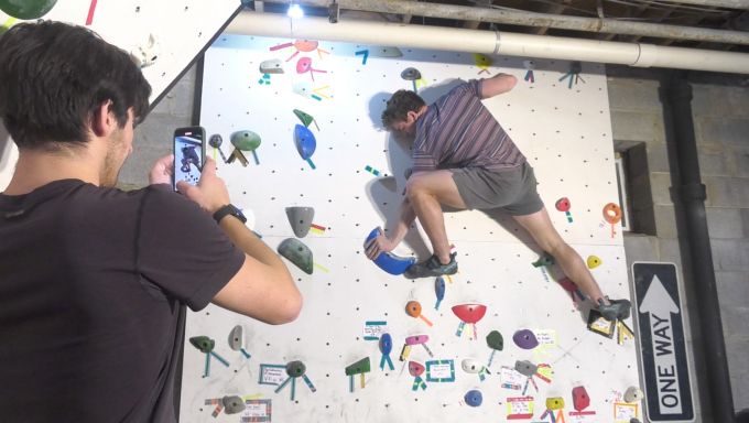 Nathan Lombardi recording Jake Fenimore Climbing in their climbing basement
