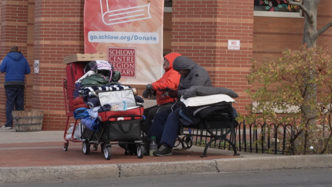 State College homeless sit on the corner of Allen Street.