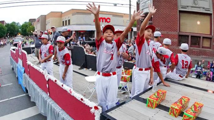 Little League players on a parade float
