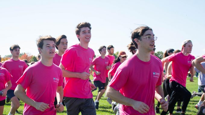 Students running in the Penn State Ice Cream Mile