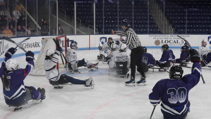 Coyotes sled hockey score goal