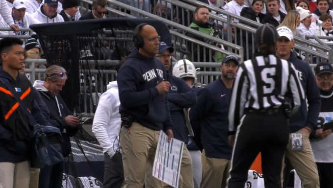 Coach James Franklin sideline speaking to refs.