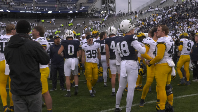 Penn State and Michigan players post game.