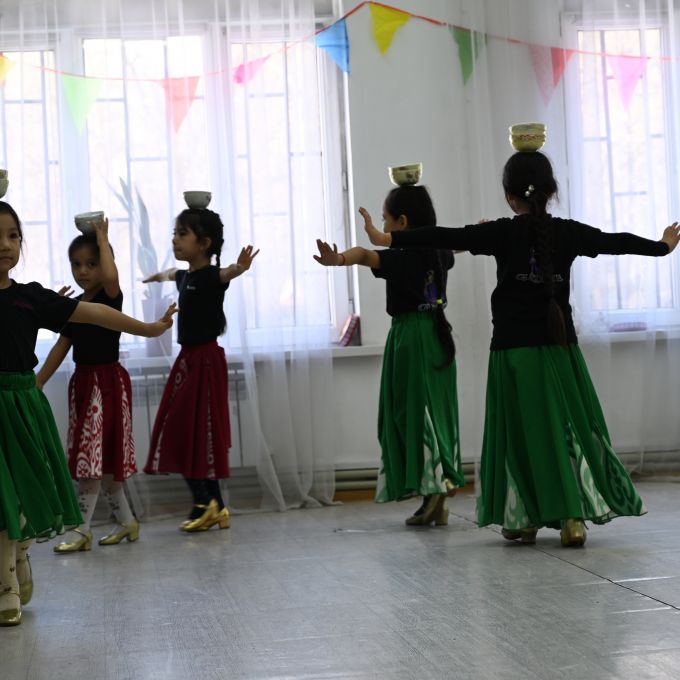 Dancers perform a Uyghur dance at the Sunshine dance studio