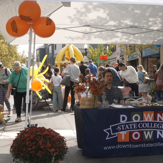 The information table at the top of South Allen Street, where the festival started.