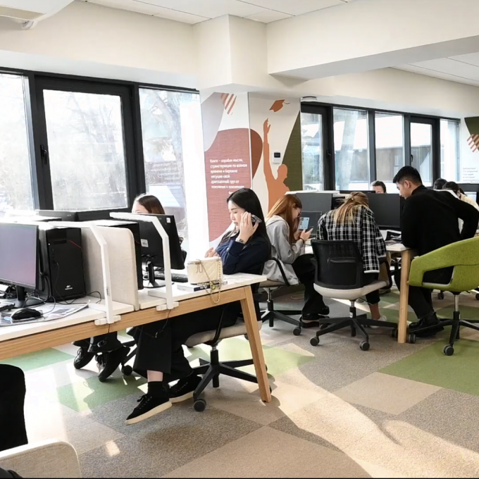 Students study at the computers in the open lab at Narxoz