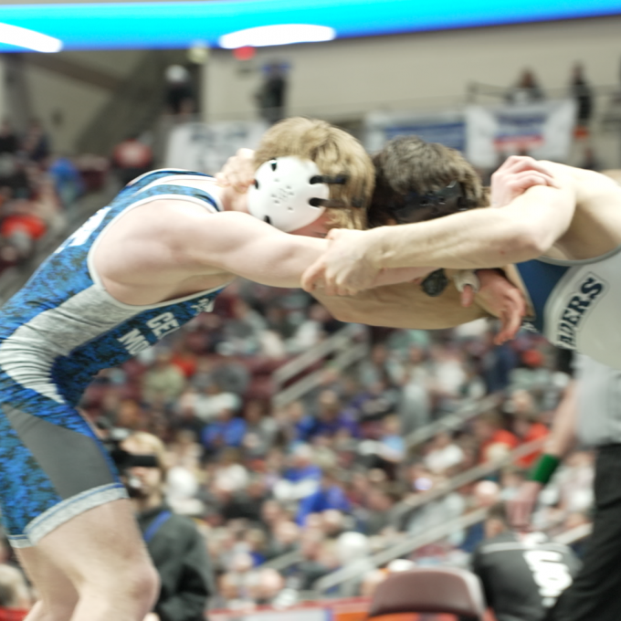 Two wrestlers facing off