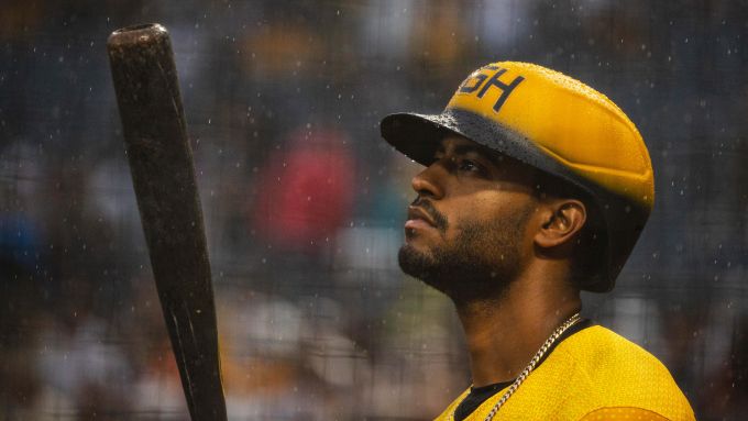 Baseball player holding a bat in the rain