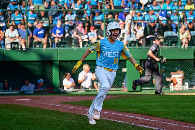 Smiling baseball player in blue and yellow