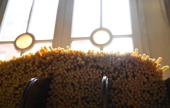 Candles for worshippers sit at the entrance of the Church of St. George (Photo by James Engel)