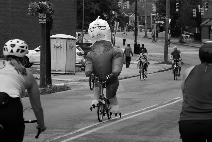 Inflatable bird on bicycle