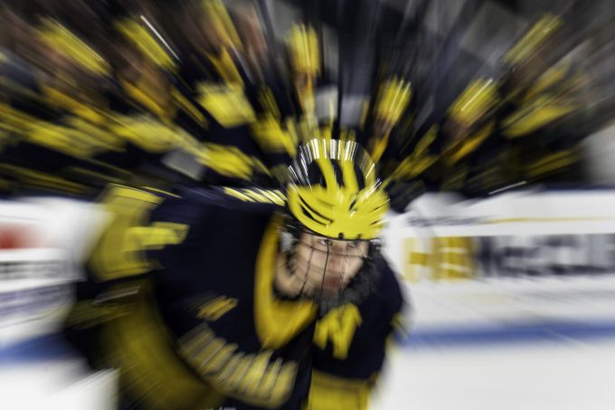 Hockey player in dark uniform