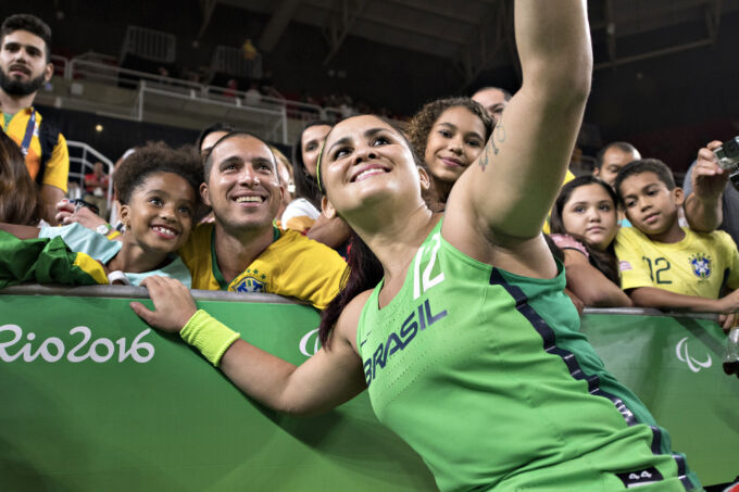 Women taking selfie with group of people