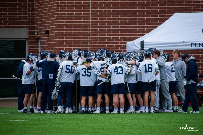 Penn State huddles together during a timeout