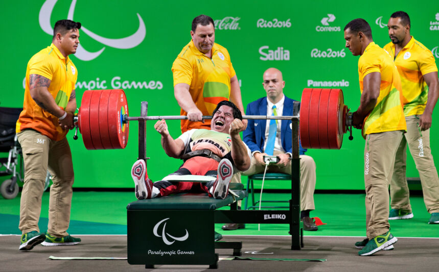 Man rises up from weightlifting bench